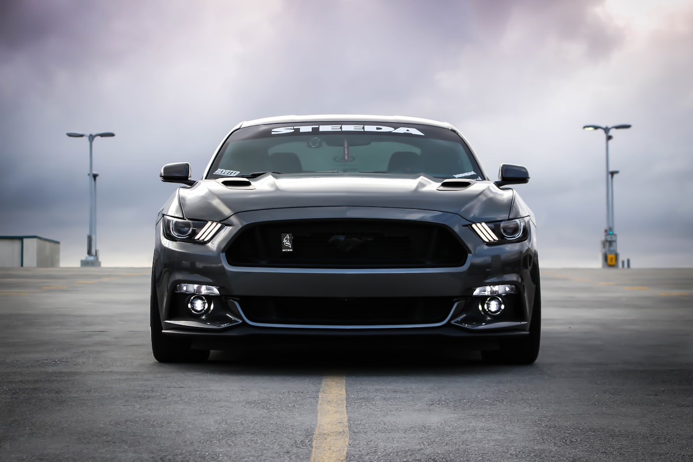 A car front end showing where a personalized license plate frame sits